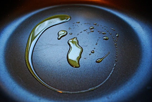 Use Oil to Clean Oil Droplets On Your Stove Top