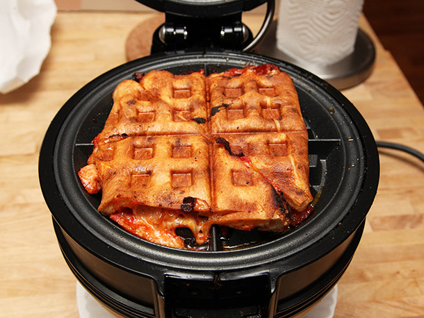 Waffle Iron Leftover Pizza into a Cheesy Calzone Snack